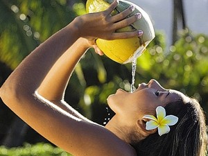 Fijian Girl drinking Coconut Juice